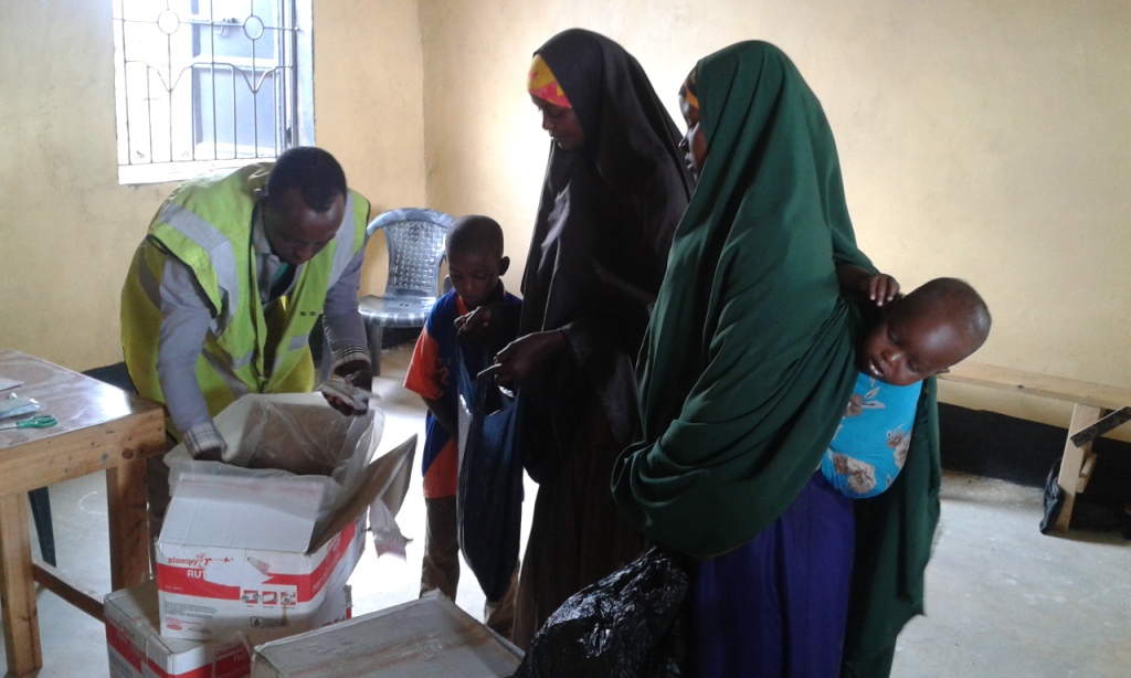 Community members and children in a room